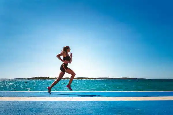Woman running showing strong leg muscle South Yardley